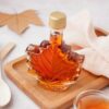 Bottle,Of,Tasty,Maple,Syrup,On,Light,Background